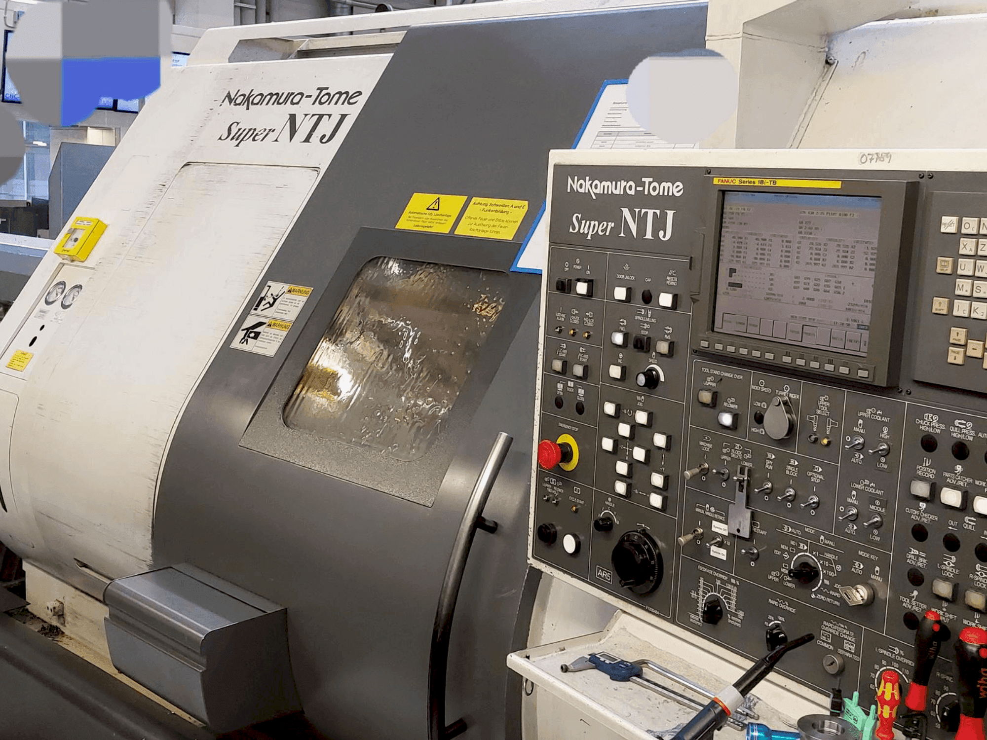 Vista frontal de la máquina NAKAMURA Super NTJ (2006)