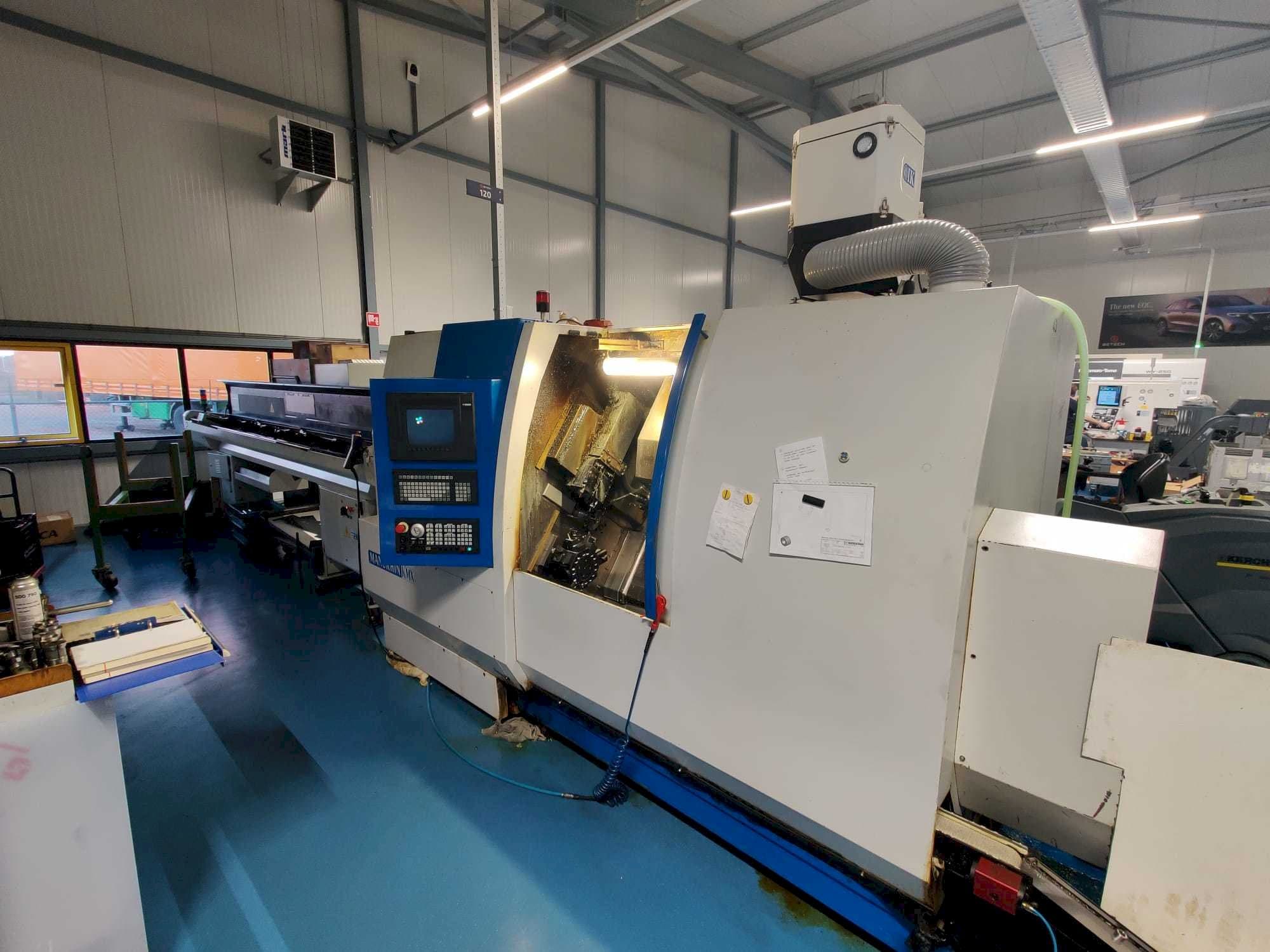 Vista frontal de la máquina Manurhin K'MX XL 32