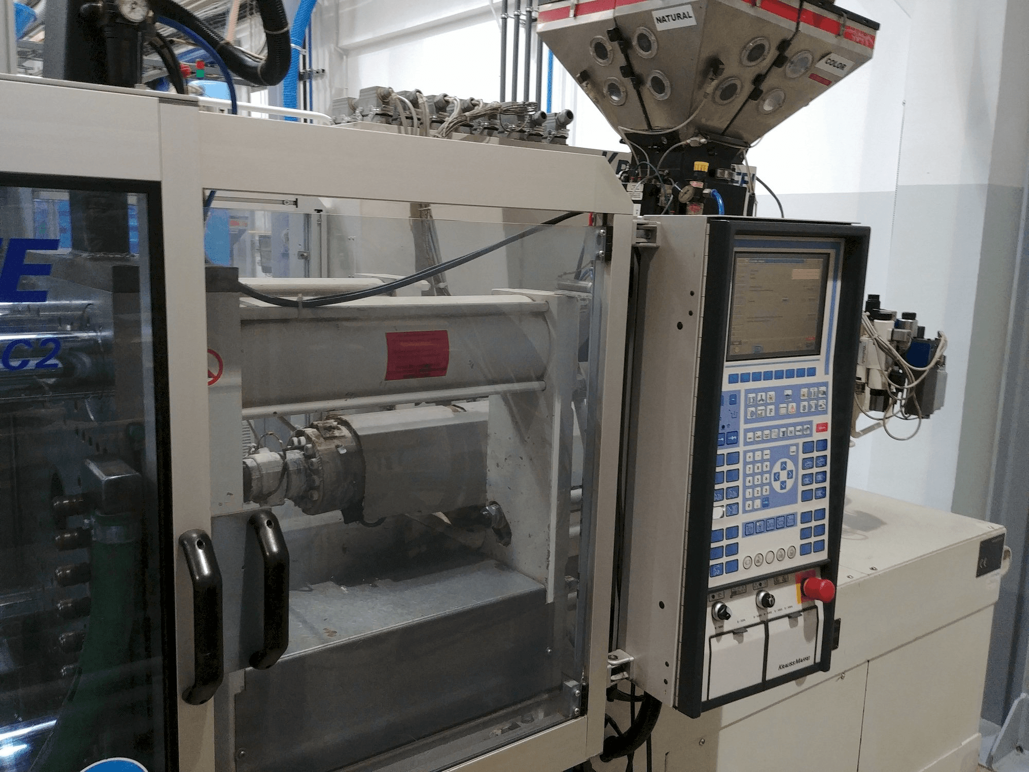 Left view of Krauss Maffei KM 80-220 C machine