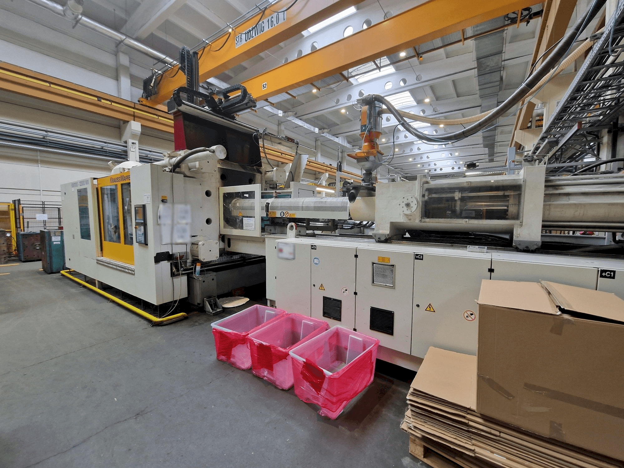 Front view of Krauss Maffei 1100-12000 MX machine